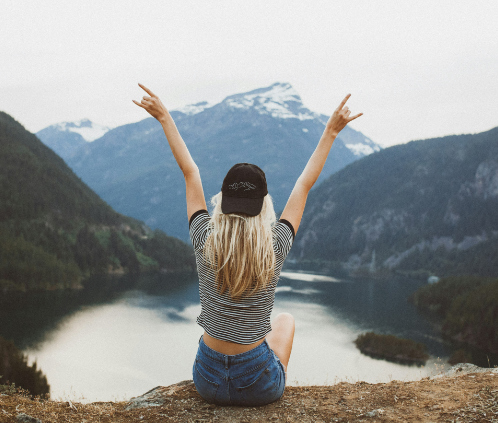 Introduction To Services Photo, for Mental Health First Responders Barrie, with woman looking out over a lake with her arms up above her head